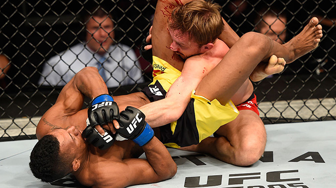 MANCHESTER, ENGLAND - OCT. 08: (L-R) Iuri Alcantara of Brazil attempts to submit Brad Pickett of England in their bantamweight bout during the UFC 204 Fight Night at the Manchester Evening News Arena. (Photo by Josh Hedges/Zuffa LLC)