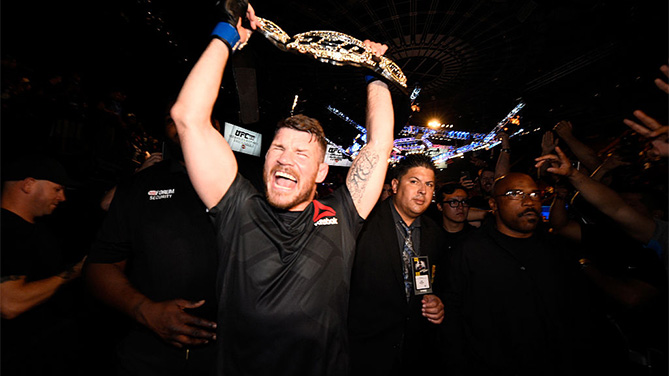 Michael Bisping celebrates after winning the UFC middleweight title at UFC 199