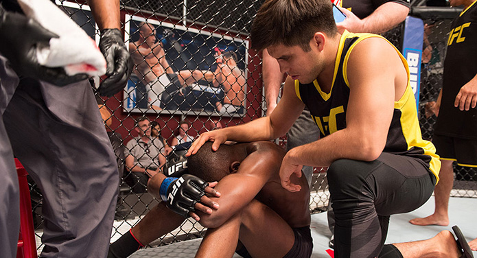 LAS VEGAS, NV - JULY 15: (R-L) Head coach Henry Cejudo consoles Nkazimulo Zulu after his submission loss to Hiromasa Ogikubo during the filming of The Ultimate Fighter: Team Benavidez vs Team Cejudo at the UFC TUF Gym on July 15, 2016 in Las Vegas, Nevada. (Photo by Elliot Howard/Zuffa LLC)