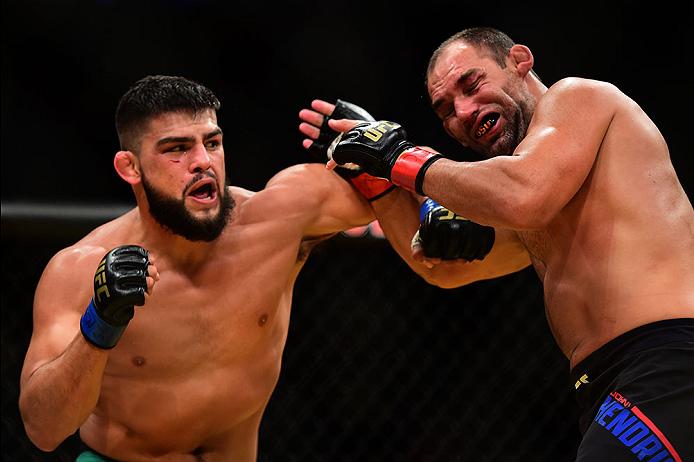 Kelvin Gastelum punches Johny Hendricks during their fight at UFC 200 in July