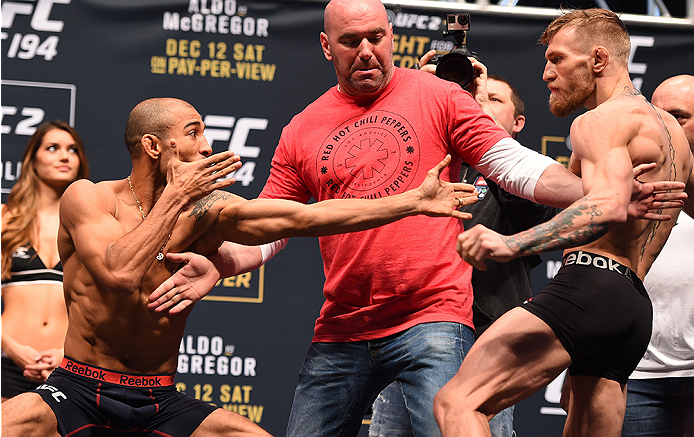 Jose Aldo and Conor McGregor face-off at the UFC 194 weigh-in before their featherweight title fight