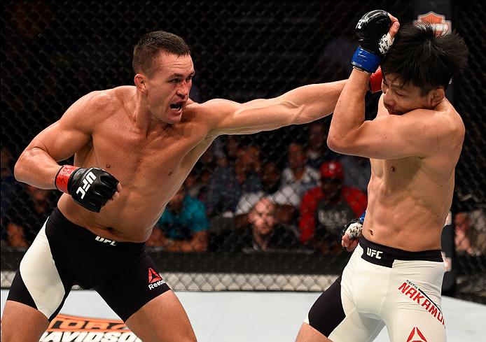 SIOUX FALLS, SD - JULY 13: (L-R) Kyle Noke punches Keita Nakamura in their welterweight bout during the UFC Fight Night event on July 13, 2016 at Denny Sanford Premier Center in Sioux Falls, South Dakota. (Photo by Jeff Bottari/Zuffa LLC)