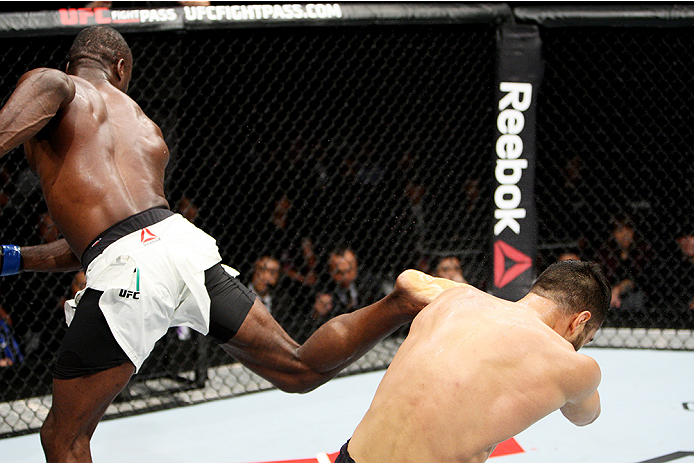 Uriah Hall lands a kick against Gegard Mousasi in their first fight in 2015