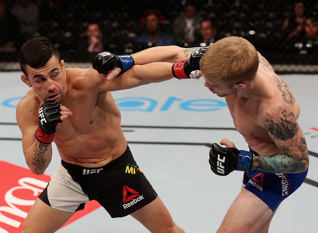 SAO PAULO, BRAZIL - NOVEMBER 19: Pedro Munhoz of Brazil punches Justin Soggins of the United States during their bantamweight fight at the UFC Fight Night Bader v Minotouro at Ibirapuera Gymnasium on November 19, 2016 in Sao Paulo, Brazil. (Photo by Buda Mendes/Zuffa LLC)