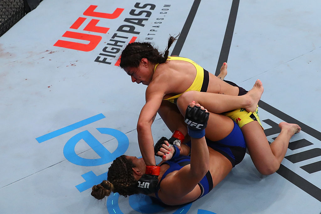 SAO PAULO, BRAZIL - NOVEMBER 19: Claudia Gadelha of Brazil punches Cortney Casey of the United States during their women's strawweight bout at the UFC Fight Night Bader v Minotouro at Ibirapuera Gymnasium on November 19, 2016 in Sao Paulo, Brazil. (Photo by Buda Mendes/Zuffa LLC)