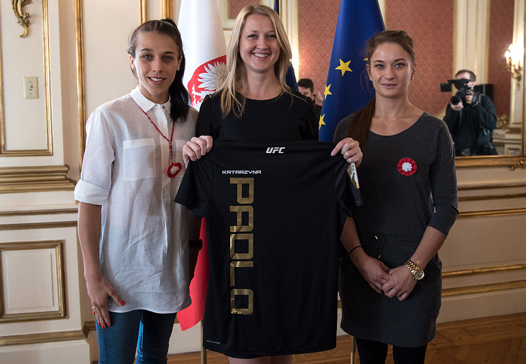 NEW YORK, NY - NOVEMBER 10: (L-R) UFC strawweight champion Joanna Jedrzejczyk, Head Consul Katarzyna Padlo, and Karolina Kowalkiewicz pose for a picture at the Polish Embassy. (Photo by Brandon Magnus/Zuffa LLC)