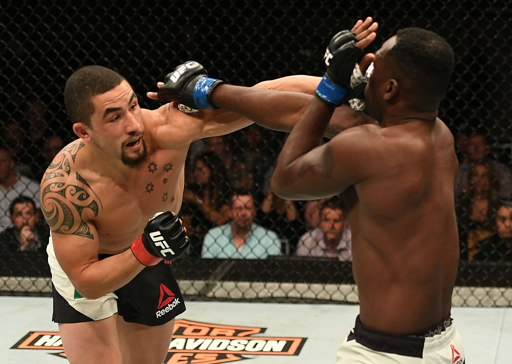 MELBOURNE, AUSTRALIA - NOVEMBER 27: (L-R) Robert Whittaker of New Zealand punches Derek Brunson in their middleweight bout during the UFC Fight Night event at Rod Laver Arena on November 27, 2016 in Melbourne, Australia. (Photo by Jeff Bottari/Zuffa LLC)