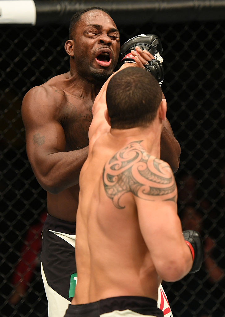 MELBOURNE, AUSTRALIA - NOVEMBER 27: (R-L) Robert Whittaker of New Zealand punches Derek Brunson in their middleweight bout during the UFC Fight Night event at Rod Laver Arena on November 27, 2016 in Melbourne, Australia. (Photo by Jeff Bottari/Zuffa LLC)