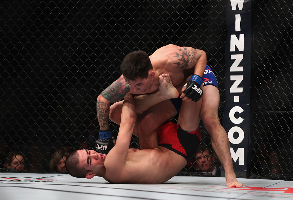 Ray Borg (top) punches Louis Smolka in their flyweight bout. (Photo by Christian Petersen/Getty Images)