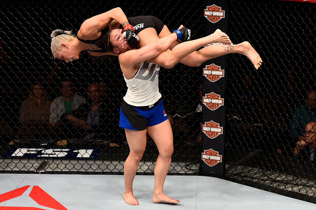 LAS VEGAS, NV - DECEMBER 03: (L-R) Jamie Moyle takes down Kailin Curran in their women's strawweight bout during The Ultimate Fighter Finale event inside the Pearl concert theater at the Palms Resort & Casino on December 3, 2016 in Las Vegas, Nevada. (Photo by Jeff Bottari/Zuffa LLC)