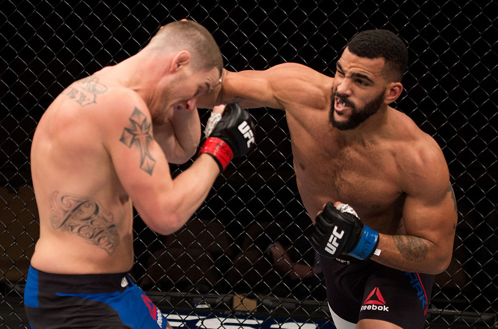 LAS VEGAS, NV - DECEMBER 03: (R-L) Devin Clark punches Josh Stansbury in their light heavyweight bout during The Ultimate Fighter Finale event inside the Pearl concert theater at the Palms Resort & Casino on December 3, 2016 in Las Vegas, Nevada. (Photo by Jeff Bottari/Zuffa LLC)