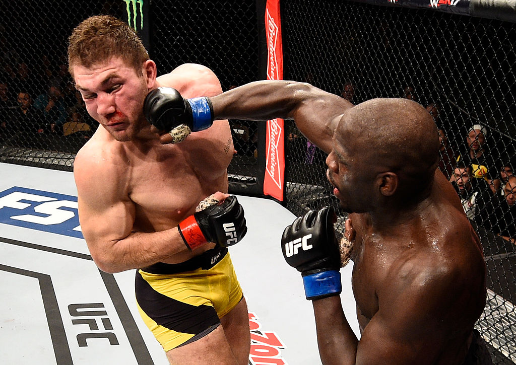 LAS VEGAS, NV - DECEMBER 03: (R-L) Jared Cannonier punches Ion Cutelaba of Moldova in their light heavyweight bout during The Ultimate Fighter Finale event inside the Pearl concert theater at the Palms Resort & Casino on December 3, 2016 in Las Vegas, Nevada. (Photo by Jeff Bottari/Zuffa LLC)