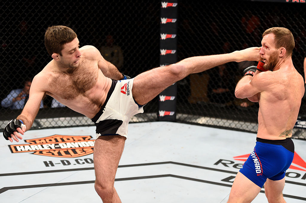 LAS VEGAS, NV - DECEMBER 03: (L-R) Ryan Hall kicks Gray Maynard in their featherweight bout during The Ultimate Fighter Finale event inside the Pearl concert theater at the Palms Resort & Casino on December 3, 2016 in Las Vegas, Nevada. (Photo by Jeff Bottari/Zuffa LLC)