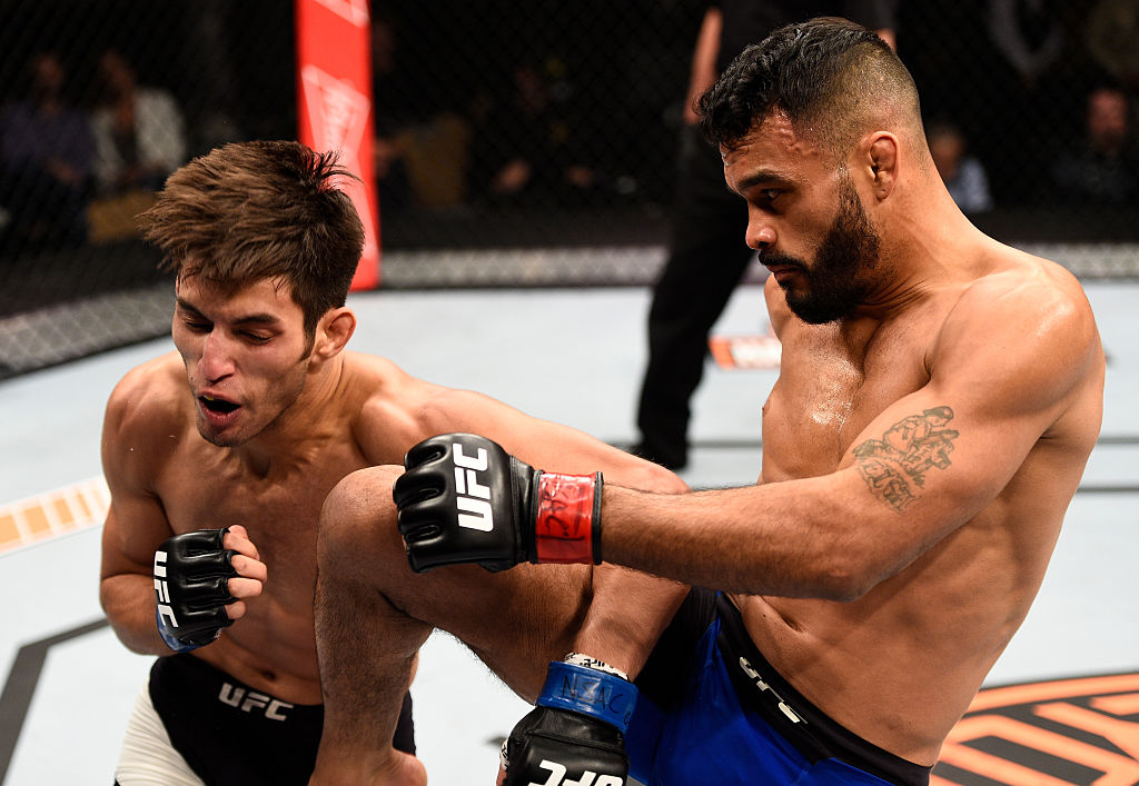 LAS VEGAS, NV - DECEMBER 03: (R-L) Rob Font knees Matt Schnell in their bantamweight bout during The Ultimate Fighter Finale event inside the Pearl concert theater at the Palms Resort & Casino on December 3, 2016 in Las Vegas, Nevada. (Photo by Jeff Bottari/Zuffa LLC)