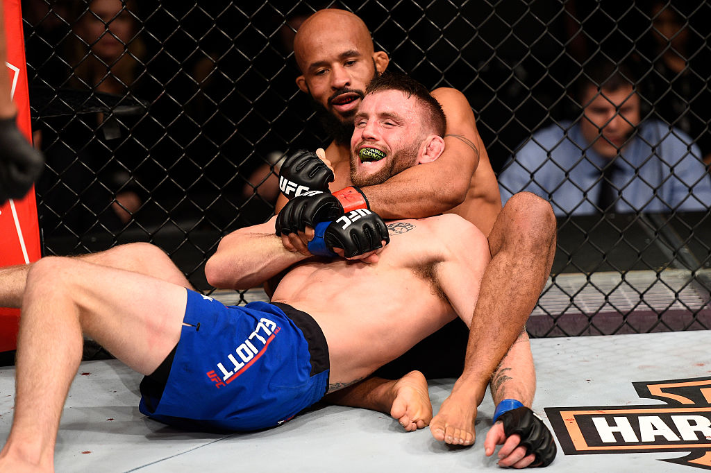 LAS VEGAS, NV - DECEMBER 03: (R-L) Demetrious Johnson attempts to secure a rear choke submission against Timothy Elliott in their flyweight championship bout during The Ultimate Fighter Finale event inside the Pearl concert theater at the Palms Resort & Casino on December 3, 2016 in Las Vegas, Nevada. (Photo by Jeff Bottari/Zuffa LLC)