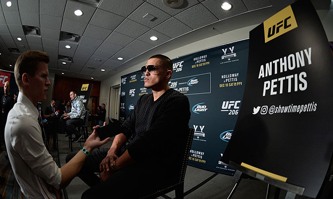 TORONTO, CANADA - DECEMBER 08: (R-L) Anthony Pettis and Max Holloway speak to the media during the UFC 206 Ultimate Media Day event inside the Westin Harbour Castle Hotel. (Photo by Brandon Magnus/Zuffa LLC)