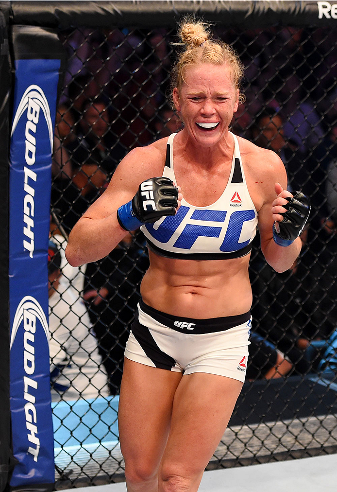 Holly Holm celebrates after becoming just the second women's bantamweight champion when she beat Ronda Rousey at UFC 193