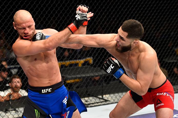 DENVER, CO - JANUARY 28: (R-L) Jorge Masvidal punches Donald Cerrone in their welterweight bout during the UFC Fight Night event at the Pepsi Center on January 28, 2017 in Denver, Colorado. (Photo by Josh Hedges/Zuffa LLC)