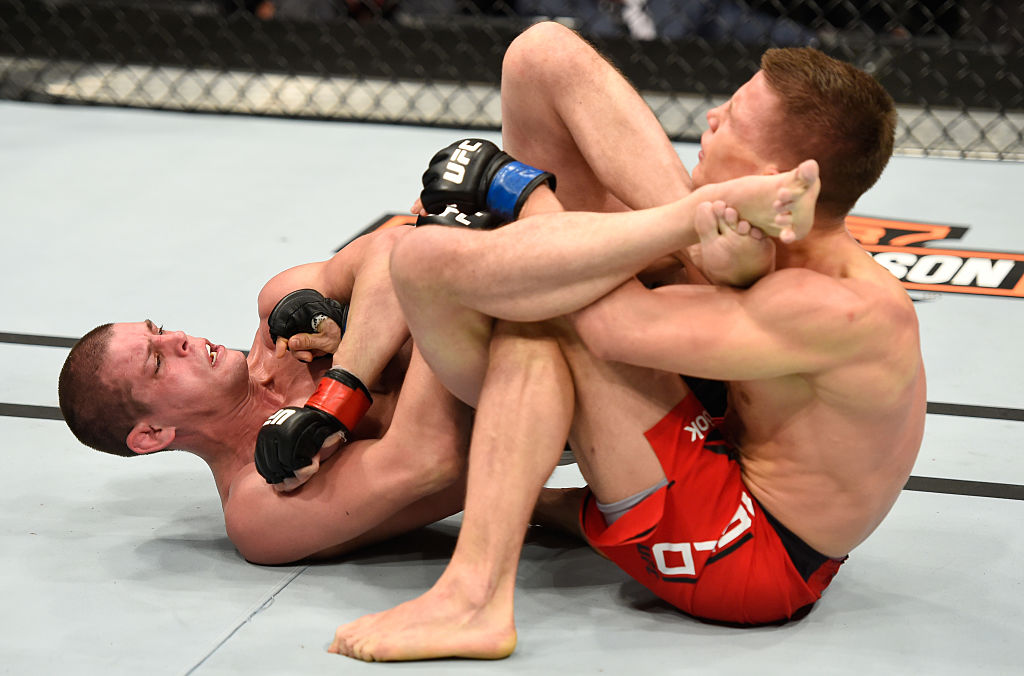 PHOENIX, AZ - JAN. 15: (L-R) Joe Lauzon attempts to submit Marcin Held of Poland in their lightweight bout during the UFC Fight Night event inside Talking Stick Resort Arena. (Photo by Jeff Bottari/Zuffa LLC)