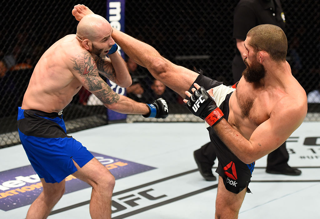 PHOENIX, AZ - JAN. 15: (R-L) Court McGee kicks Ben Saunders in their welterweight bout during the UFC Fight Night event inside Talking Stick Resort Arena. (Photo by Jeff Bottari/Zuffa LLC)