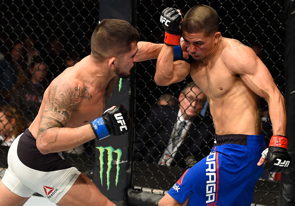 PHOENIX, AZ - JAN. 15: (L-R) Sergio Pettis punches John Moraga in their flyweight bout during the UFC Fight Night event inside Talking Stick Resort Arena. (Photo by Jeff Bottari/Zuffa LLC)