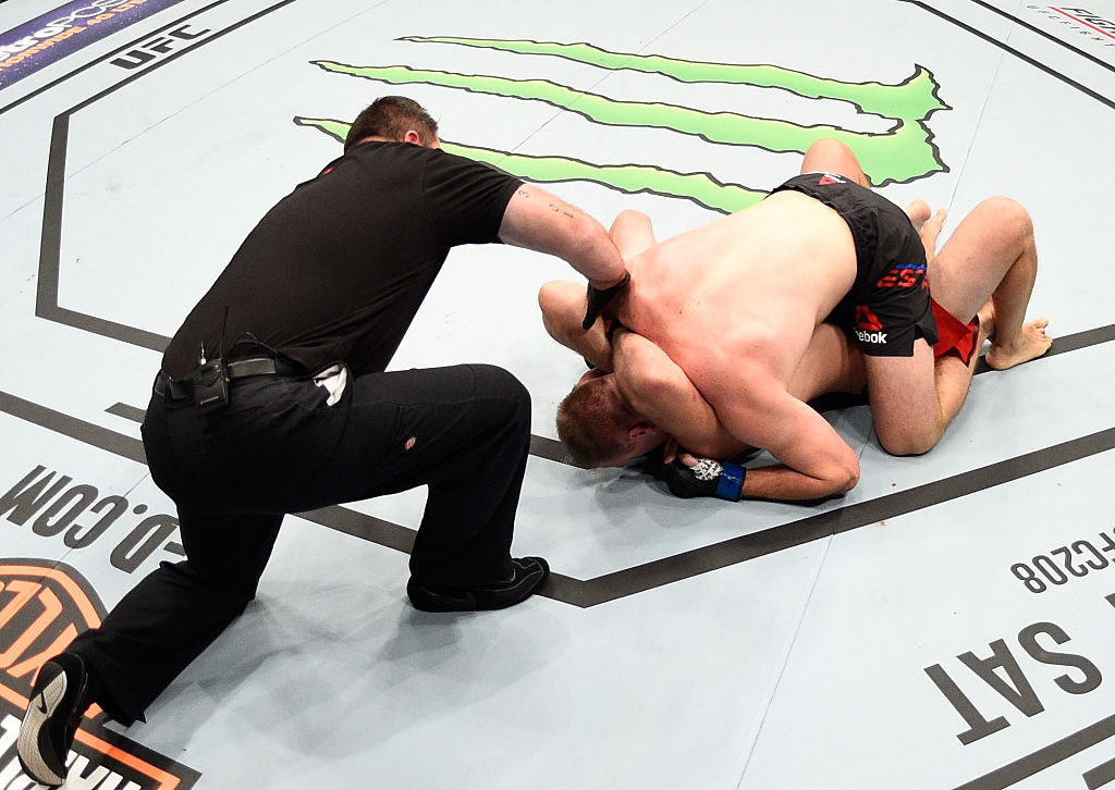 PHOENIX, AZ - JAN. 15: (L-R) Aleksei Oleinik of Russia submits Viktor Pesta of Czech Republic in their heavyweight bout during the UFC Fight Night event inside Talking Stick Resort Arena. (Photo by Jeff Bottari/Zuffa LLC)