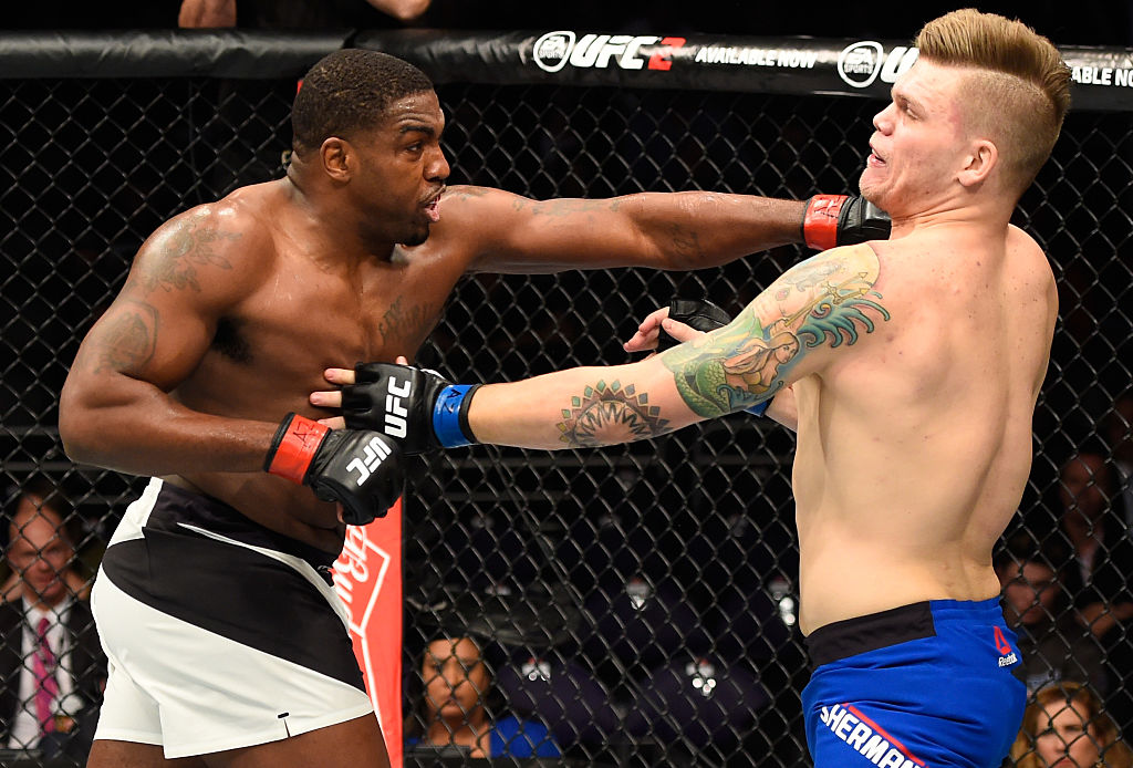 PHOENIX, AZ – JAN. 15: (L-R) Walt Harris punches Chase Sherman in their heavyweight bout during the UFC Fight Night event inside Talking Stick Resort Arena. (Photo by Jeff Bottari/Zuffa LLC)