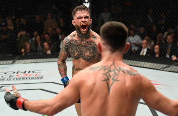 LAS VEGAS, NV - DEC. 30: (L-R) Cody Garbrandt and Dominick Cruz taunt each other in their UFC bantamweight championship bout during the UFC 207 event at T-Mobile Arena. (Photo by Josh Hedges/Zuffa LLC)