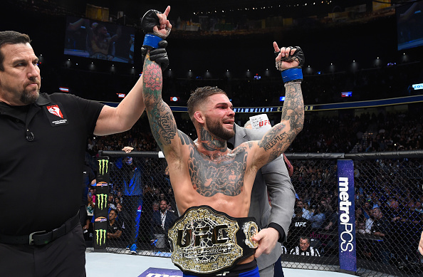 <a href='../fighter/cody-garbrandt'>Cody Garbrandt</a> celebrates after defeating <a href='../fighter/Dominick-Cruz'>Dominick Cruz</a> at UFC 207 to become bantamweight champ“ align=“center“/></div><div readability=