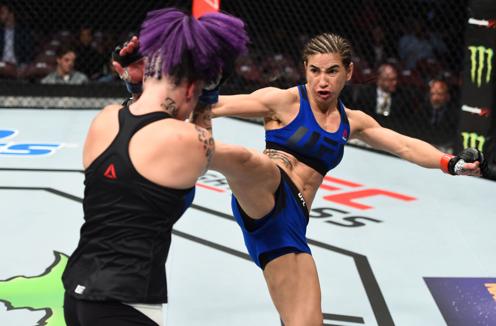 Tecia Torres kicks Bec Rawlings of Australia in their women's strawweight bout. (Photo by Jeff Bottari/Zuffa LLC/Zuffa LLC via Getty Images)