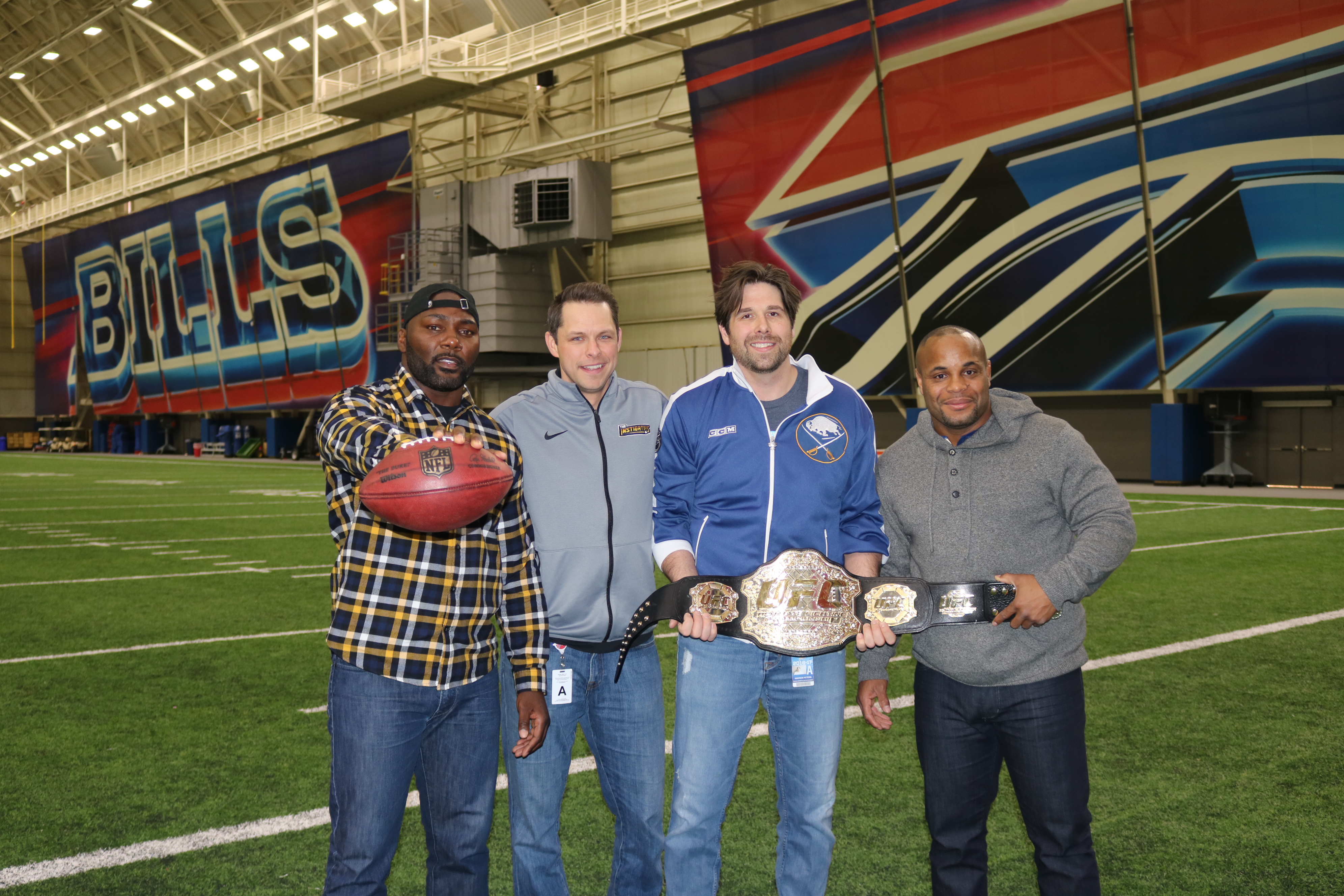 (From left to right) Anthony Johnson, Martin Biron, Andrew Peters, and Daniel Cormier pose for a photo after the two UFC fighters appears on their radio show, The Instigators in Buffalo, N.Y. on Friday, Feb. 17. (Photo by Matt Parrino)