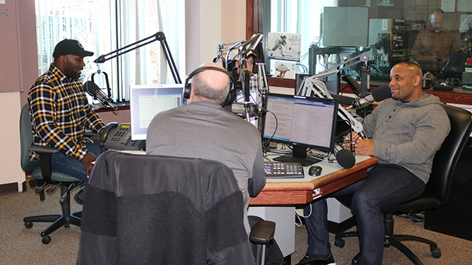 Anthony Johnson (far left) and Daniel Cormier (far right) talk about their UFC 210 main event title fight in Buffalo, N.Y. during an interview with Howard Simon and Jeremy White on WGR Sports Radio 55 on Friday, Feb. 17. (Photo by Matt Parrino)