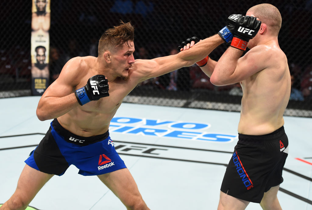 HOUSTON, TX - FEBRUARY 04: (L-R) Niko Price punches Alex Morono in their welterweight bout during the UFC Fight Night event at the Toyota Center on February 4, 2017 in Houston, Texas. (Photo by Jeff Bottari/Zuffa LLC)