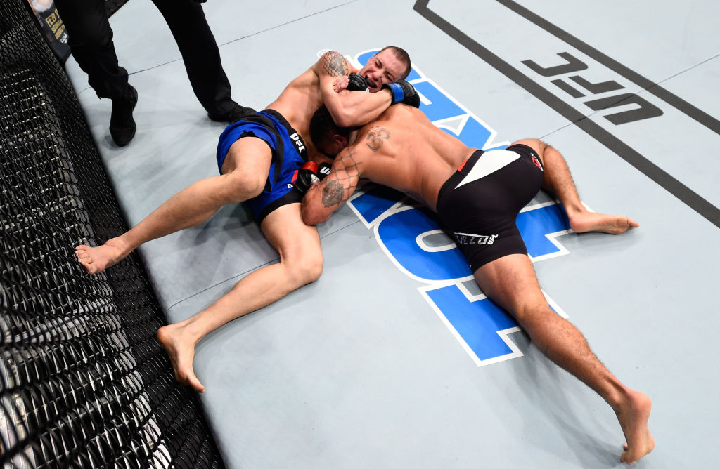 HOUSTON, TX - FEBRUARY 04: (L-R) James Vick attempts to submit Abel Trujillo in their lightweight bout during the UFC Fight Night event at the Toyota Center on February 4, 2017 in Houston, Texas. (Photo by Jeff Bottari/Zuffa LLC)