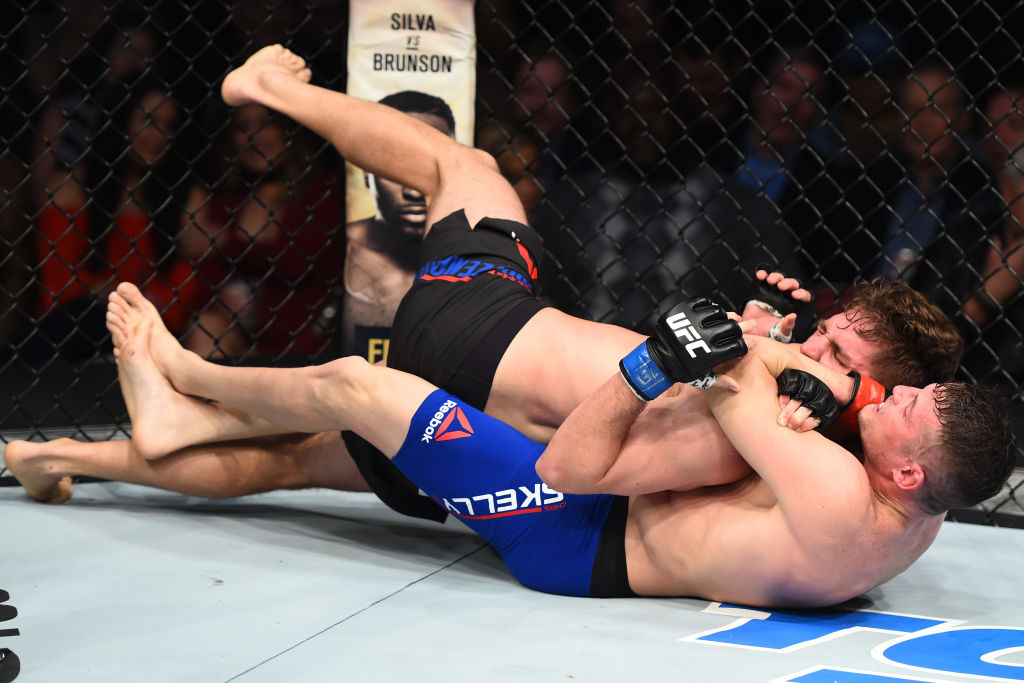 HOUSTON, TX - FEBRUARY 04: (L-R) Chas Skelly submits Chris Gruetzemacher in their featherweight bout during the UFC Fight Night event at the Toyota Center on February 4, 2017 in Houston, Texas. (Photo by Jeff Bottari/Zuffa LLC)