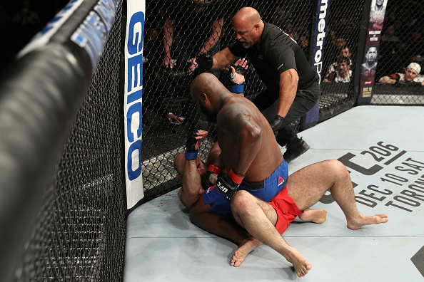 Derrick Lewis punches Shamil Abdurakhimov during their heavyweight bout at Fight Night Albany