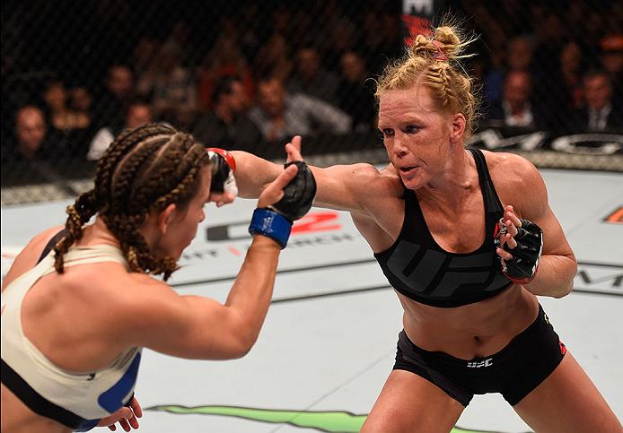 LAS VEGAS, NV - MARCH 05: (L-R) Holly Holm punches Miesha Tate in their UFC women's bantamweight championship bout during the UFC 196 event inside MGM Grand Garden Arena. (Photo by Josh Hedges/Zuffa LLC)