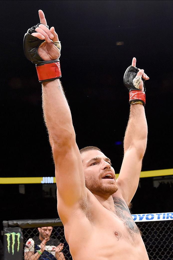 Jim Miller celebrates after his win at UFC 200 last July