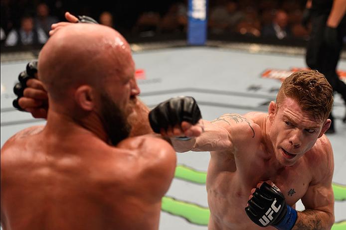 Paul Felder punches Josh Burkman during their bout in May of 2016
