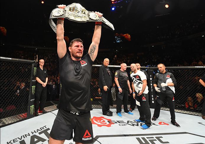 Michael Bisping celebrates after defending his middleweight title against Dan Henderson at UFC 204