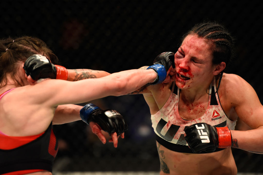 LONDON, ENGLAND - MARCH 18: (L-R) Lucie Pudilova of the Czech Republic punches Lina Lansberg of Sweden in their women's bantamweight fight during the UFC Fight Night event at The O2 arena on March 18, 2017 in London, England. (Photo by Josh Hedges/Zuffa LLC)