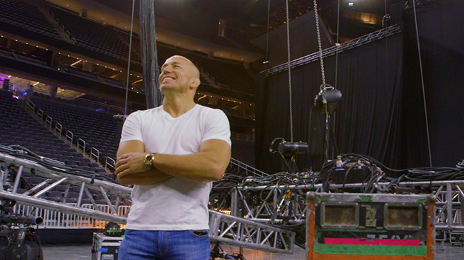 Georges St-Pierre smiles while standing in the middle of T-Mobile Arena in Las Vegas, NV. The former welterweight champion's return to the UFC was announced this week and he's in Las Vegas getting reacquainted.