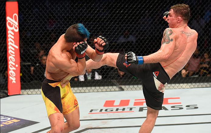LAS VEGAS, NV - MARCH 04: (R-L) Darren Elkins kicks Mirsad Bektic of Bosnia in their featherweight bout during the UFC 209 event at T-Mobile Arena on March 4, 2017 in Las Vegas, Nevada. (Photo by Josh Hedges/Zuffa LLC)