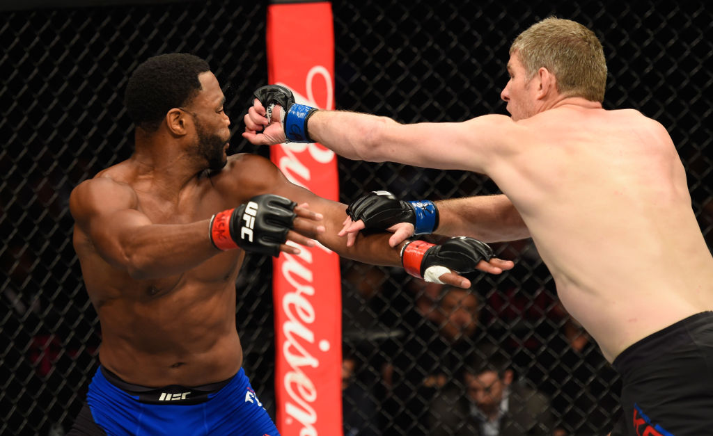 LAS VEGAS, NV - MARCH 04: (R-L) Daniel Kelly of Australia punches Rashad Evans in their middleweight bout during the UFC 209 event at T-Mobile Arena on March 4, 2017 in Las Vegas, Nevada. (Photo by Josh Hedges/Zuffa LLC)