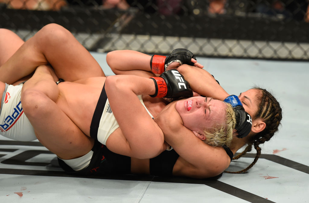 LAS VEGAS, NV - MARCH 04: Cynthia Calvillo (black) attempts to submit Amanda Cooper in their women's strawweight bout during the UFC 209 event at T-Mobile Arena on March 4, 2017 in Las Vegas, Nevada. (Photo by Josh Hedges/Zuffa LLC)