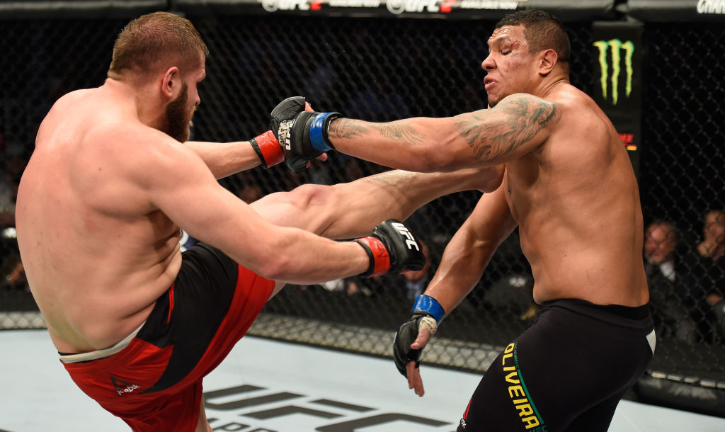 LAS VEGAS, NV - MARCH 04: (L-R) Marcin Tybura of Poland kicks Luis Henrique of Brazil in their heavyweight bout during the UFC 209 event at T-Mobile Arena on March 4, 2017 in Las Vegas, Nevada. (Photo by Josh Hedges/Zuffa LLC)