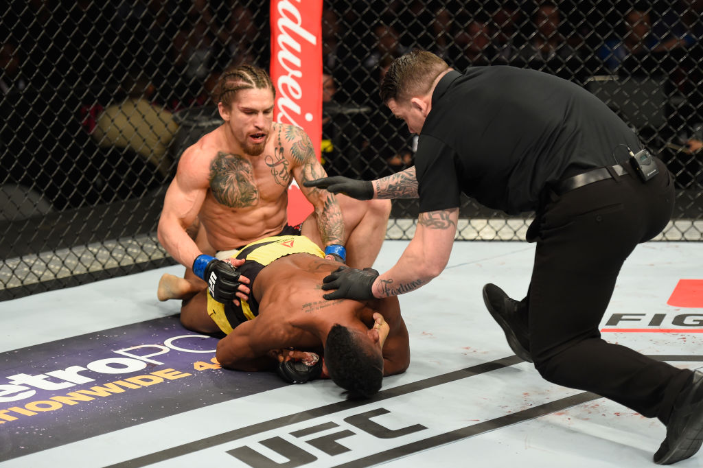 LAS VEGAS, NV - MARCH 04: Iuri Alcantara of Brazil (yellow trunks) attempts to submit Luke Sanders (top) in their bantamweight bout during the UFC 209 event at T-Mobile Arena on March 4, 2017 in Las Vegas, Nevada. (Photo by Josh Hedges/Zuffa LLC)