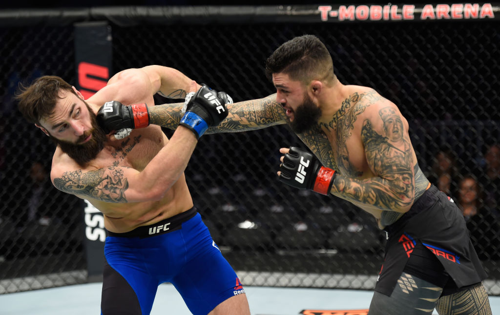 LAS VEGAS, NV - MARCH 04: (R-L) Tyson Pedro of Australia punches Paul Craig of Scotland in their light heavyweight bout during the UFC 209 event at T-Mobile Arena on March 4, 2017 in Las Vegas, Nevada. (Photo by Josh Hedges/Zuffa LLC)