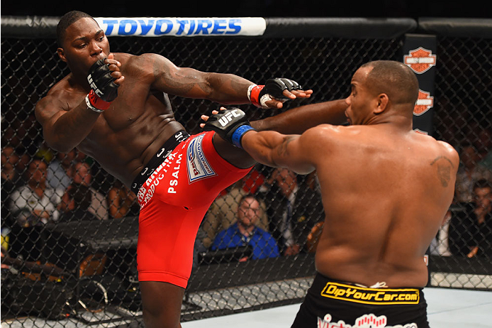 LAS VEGAS, NV - MAY 23: (L-R) Anthony Johnson kicks Daniel Cormier in their UFC light heavyweight championship bout during the UFC 187 event at the MGM Grand Garden Arena on May 23, 2015 in Las Vegas, Nevada. (Photo by Josh Hedges/Zuffa LLC)