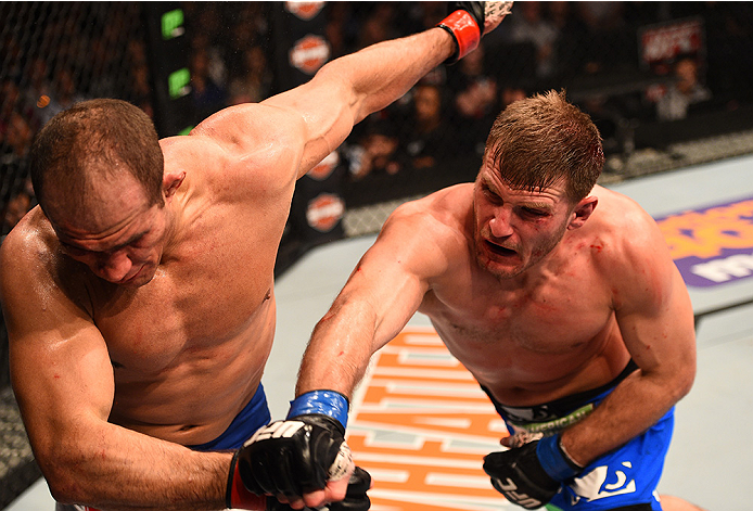 Stipe Miocic punches Junior Dos Santos during their bout at in December of 2014